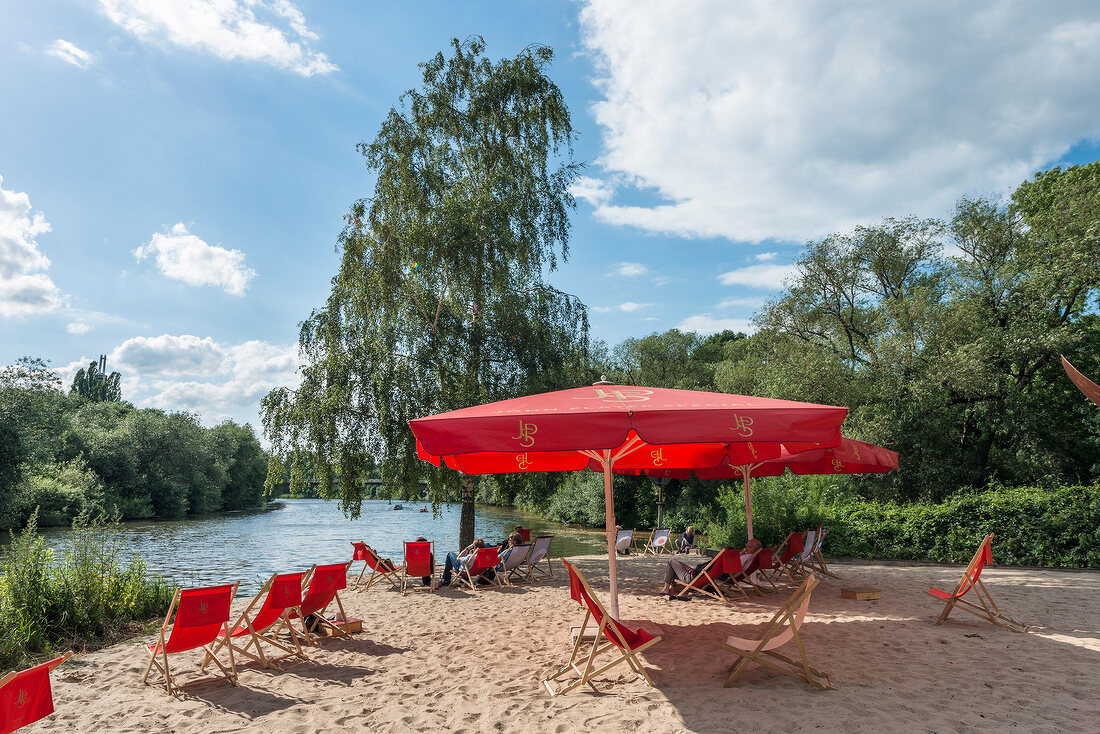People relaxing on beach at Weddige bank 29 in Linden, Hannover, Germany