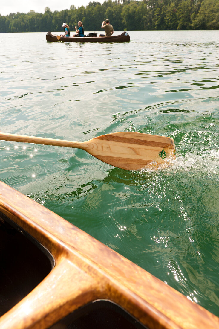 Close-up of paddle canoes boat in lake