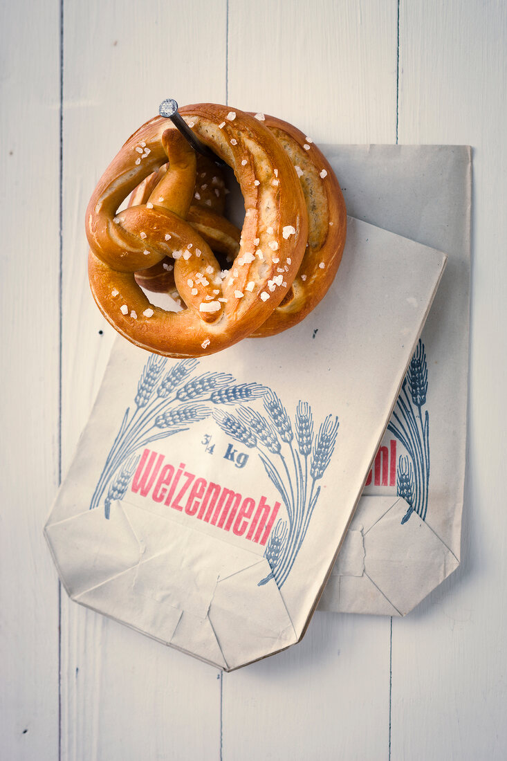 Pretzels hanged on wooden wall