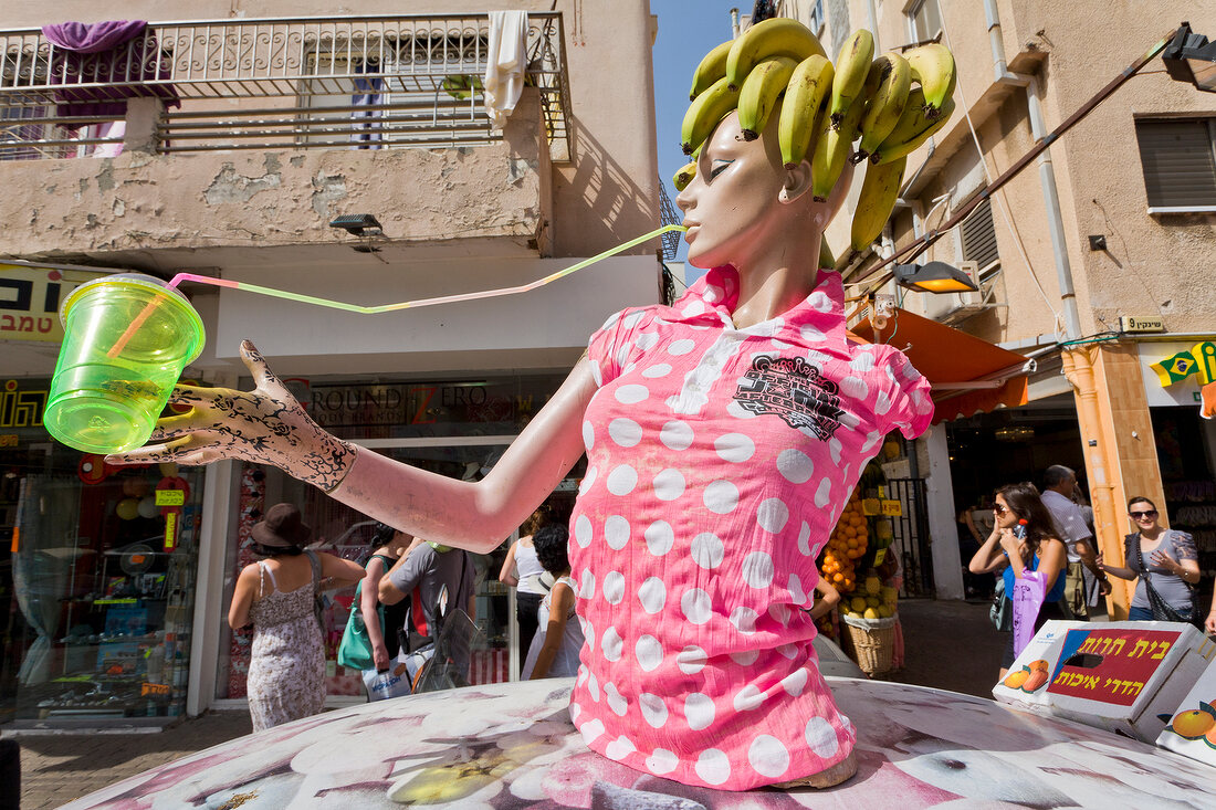 Doll at fruit juice stand at Sheinkin street, Tel Aviv, Isreal