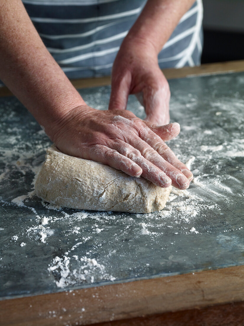 Close-up of kneading dough, step 1