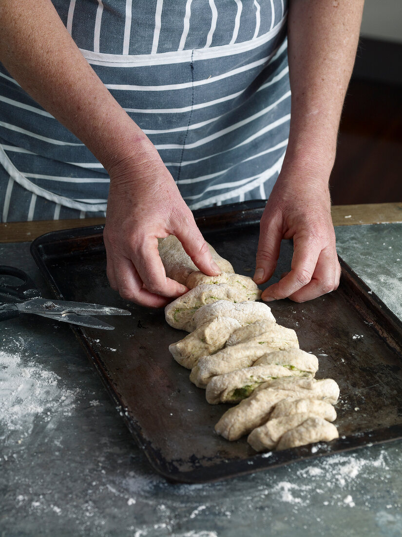 Close-up of forming braid of stuffed dough, step 3