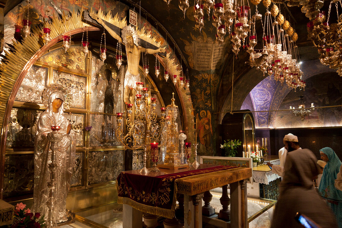 Pilgrim women at Holy Sepulchre in Calvary Chapel, Jerusalem, Israel