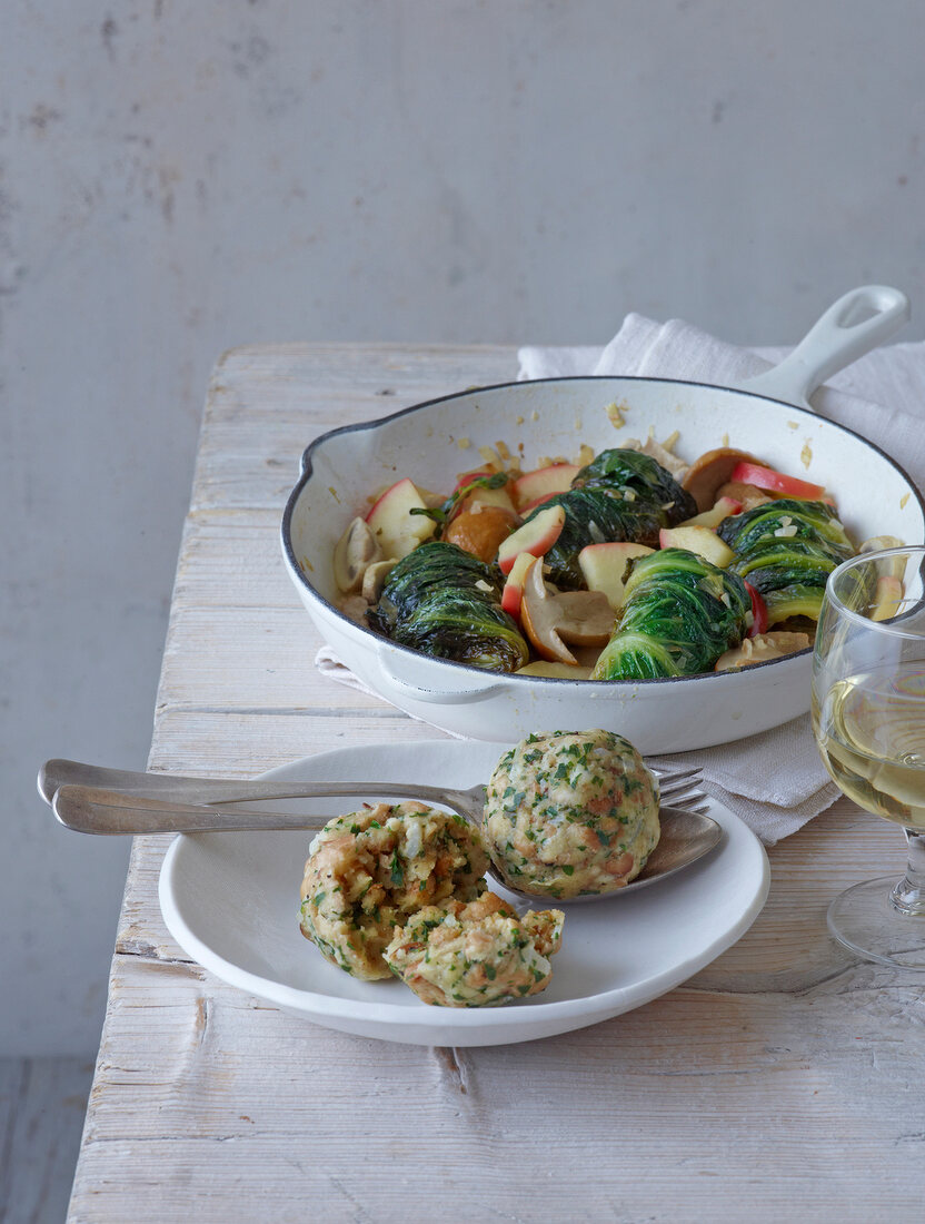 Schmor salad in pan and rahm dumplings on plate