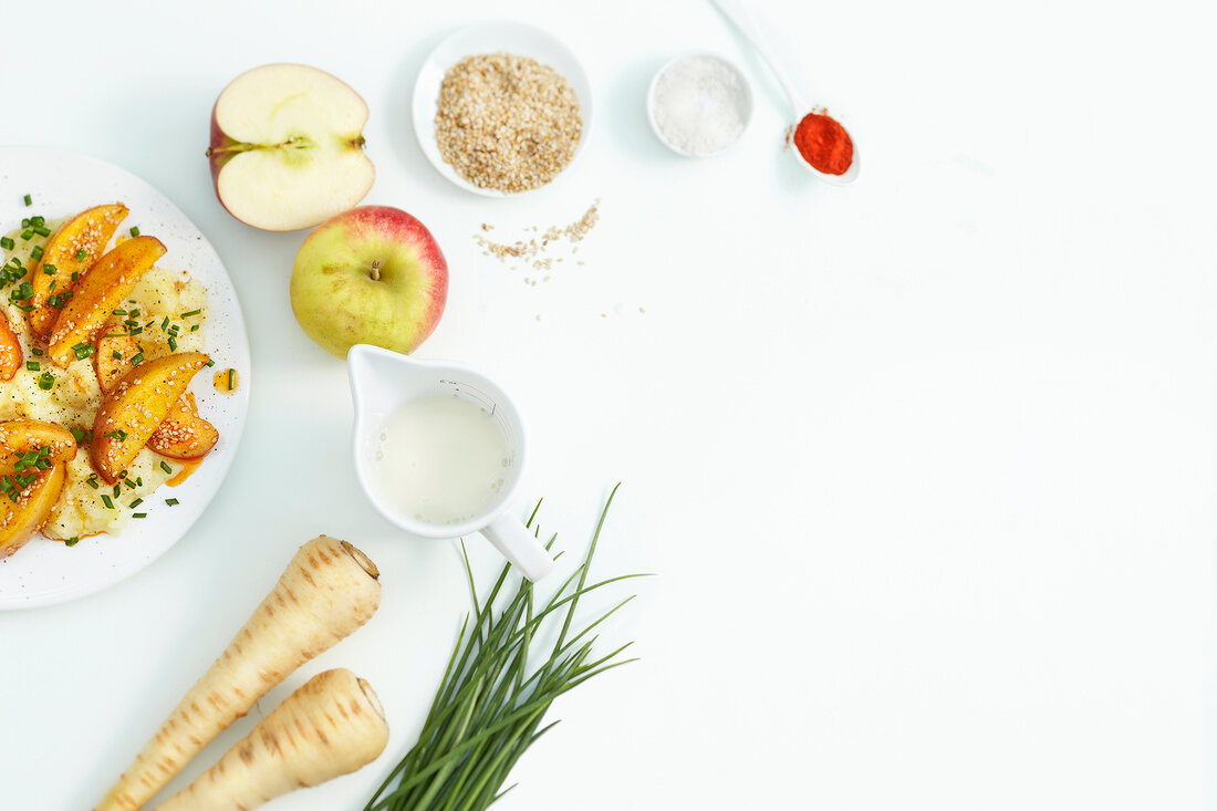 Chilli, apples, parsnip mash and other ingredients on white background