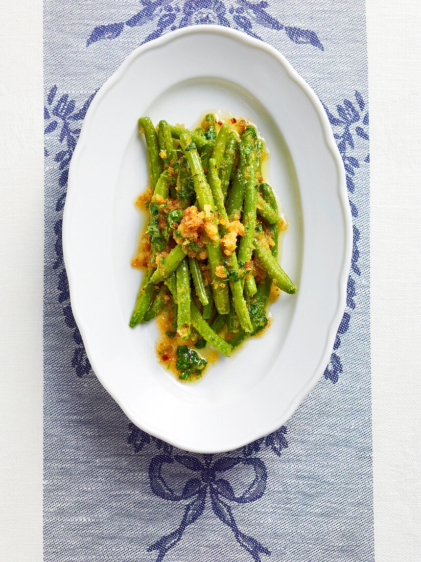 Beans with corn crumbs on serving dish, Bavaria, Germany