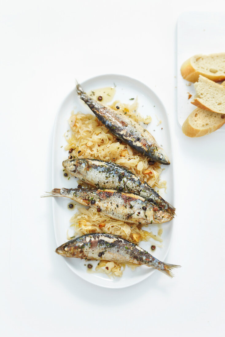 Sardines with garlic herb in serving dish