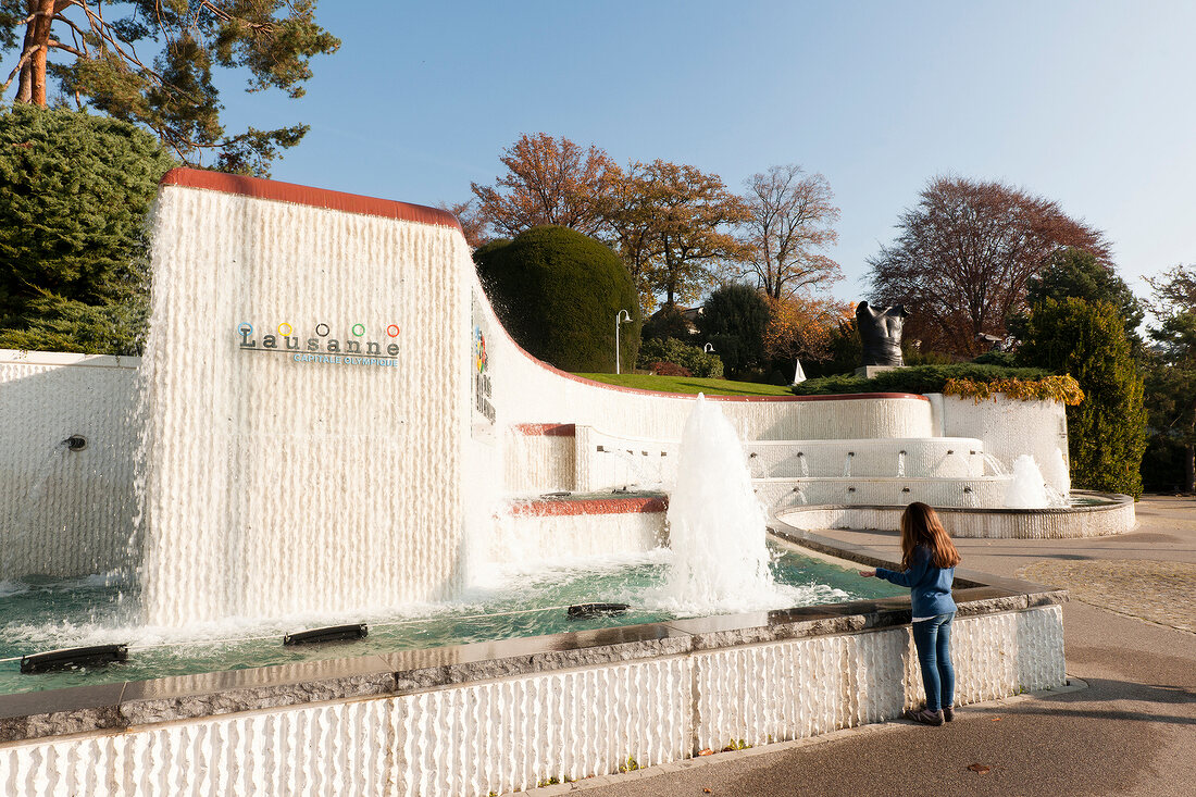 Girl standing near fountain at Lausanne, Canton of Vaud, Switzerland