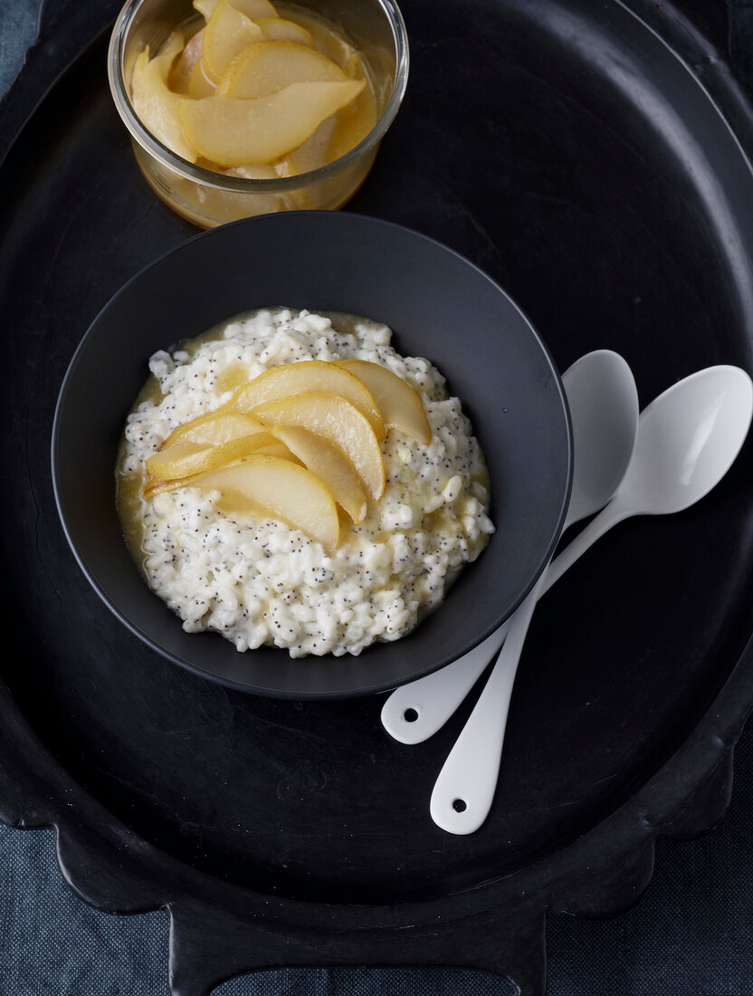 Poppy seed rice pudding with caramelized pears in bowl