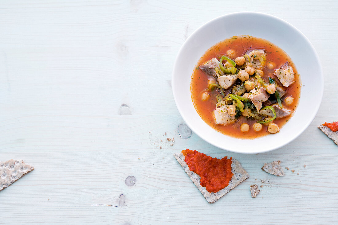 Chickpea soup with mackerel in bowl