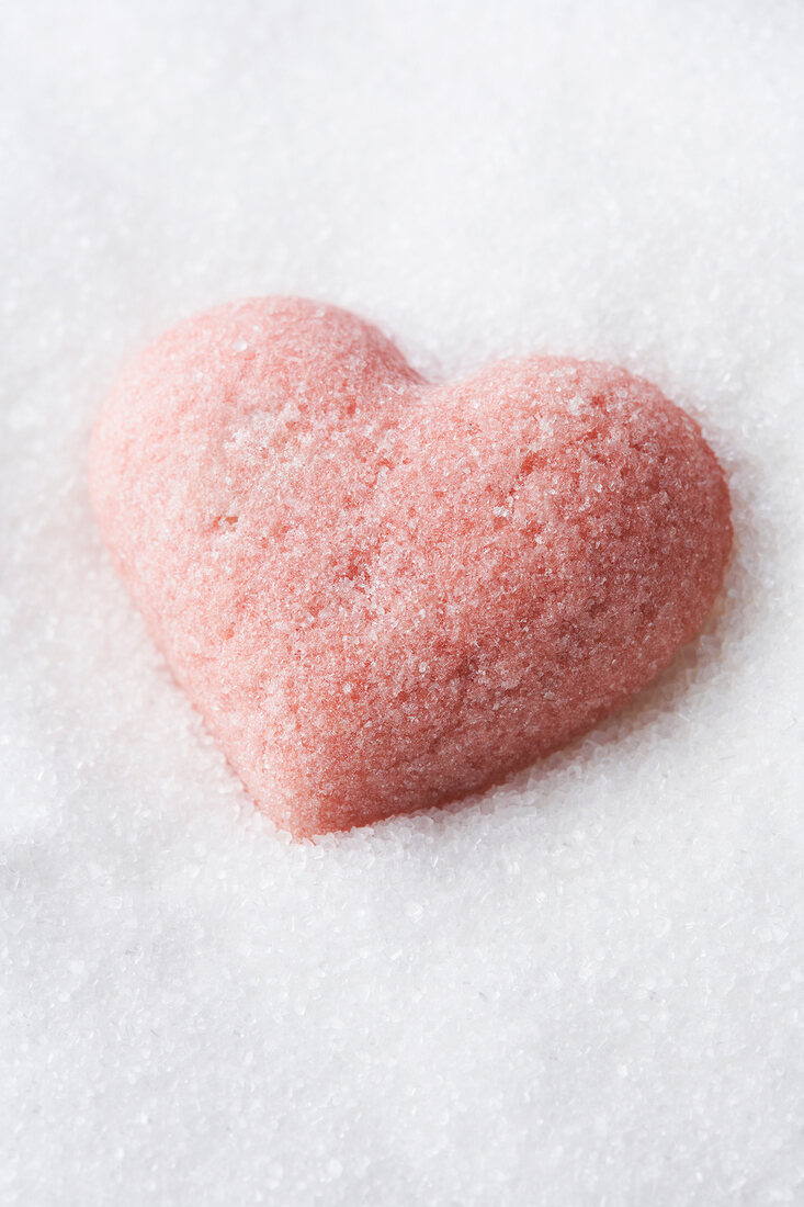 Close-up of red sugar heart in sugar