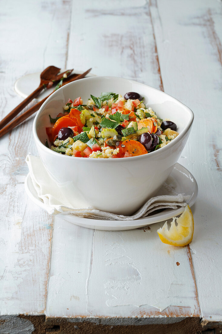 Bowl of millet salad on plate