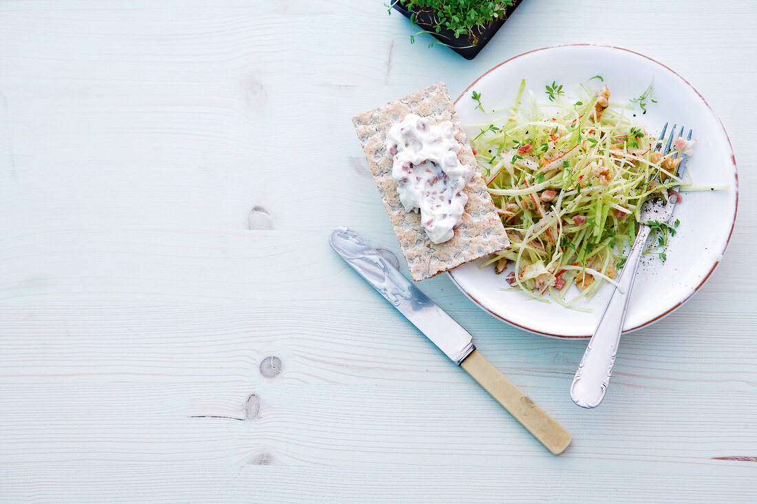 Cabbage salad with pears on plate, overhead view