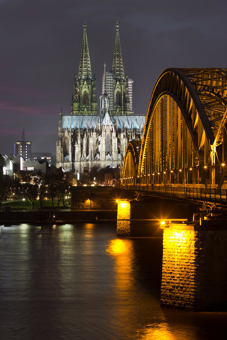 View of Cologne Cathedral and Hohenzollern Bridge at night, Cologne, Germany