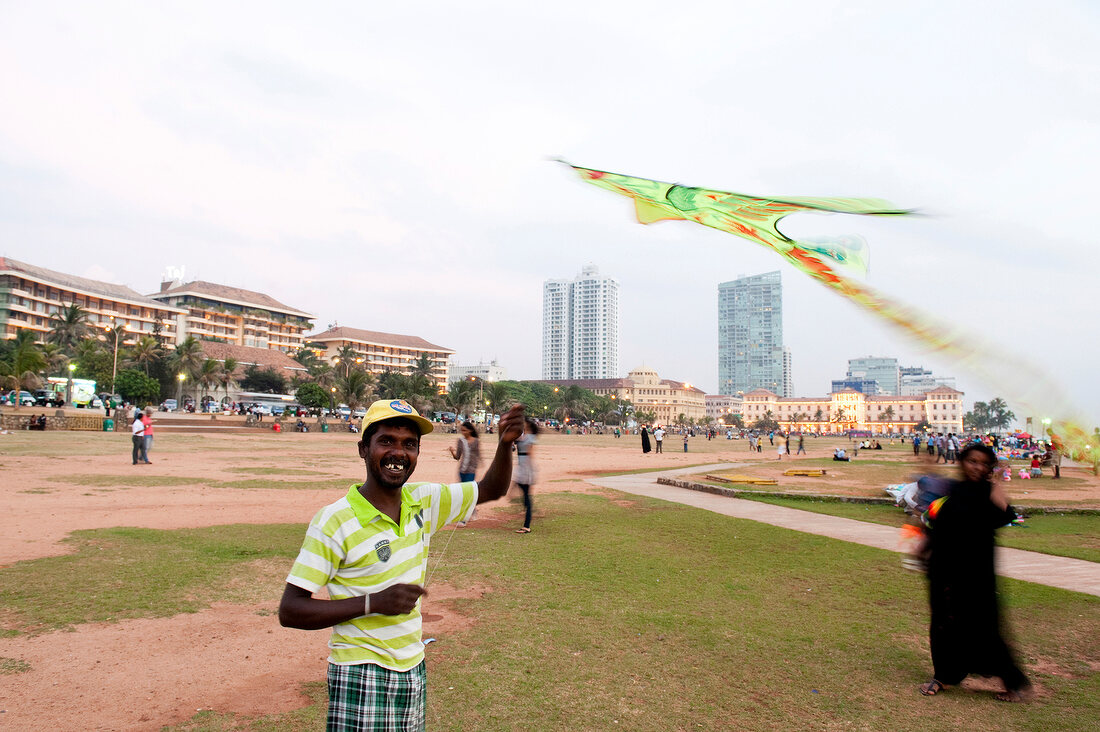 People at park in front of Galle Face Hotel, Colombo, Sri Lanka, blurred motion