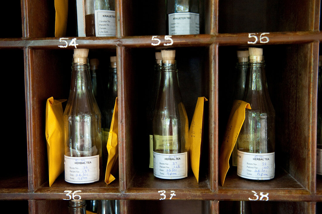 Close-up of bottles in numbered shelves at Barberyn Reef Ayurveda Resort in Sri Lanka