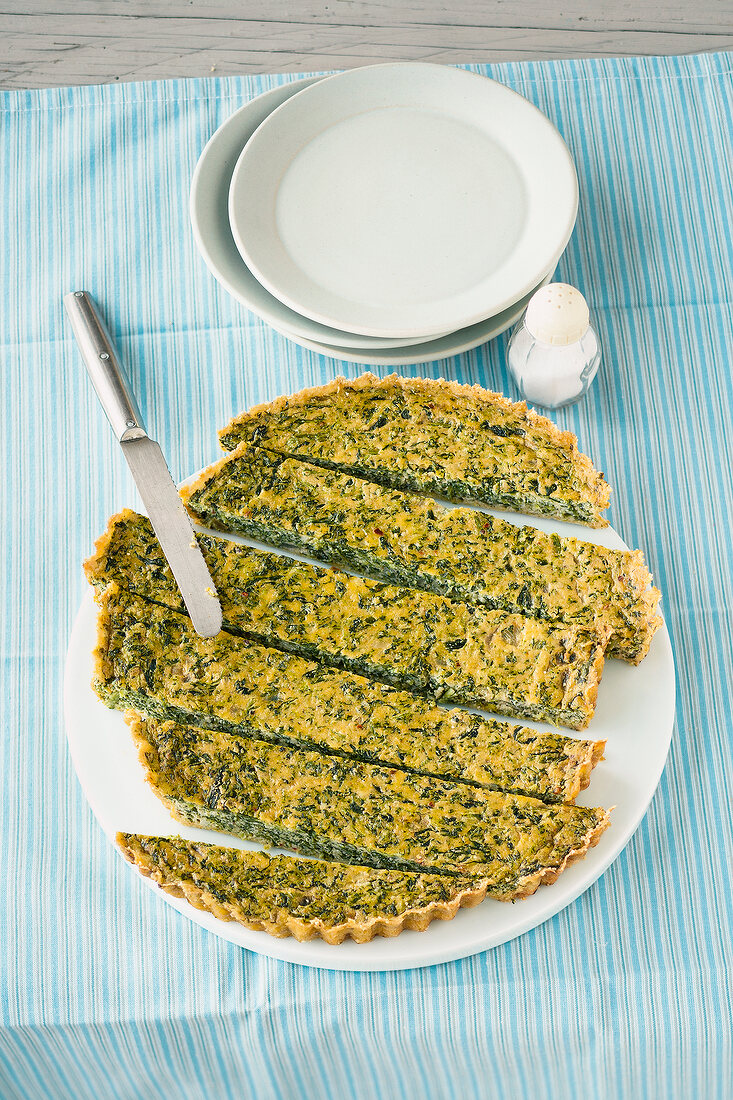 Cut spinach tart on plate
