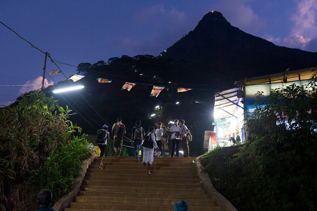 Pilgrims climbing stairs at night in Sri Pada mountain, Sri Lanka