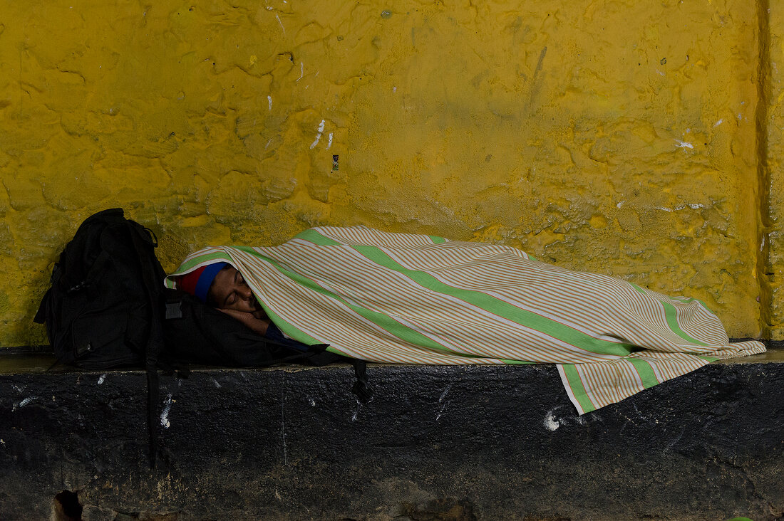 Man sleeping on street, Sri Lanka