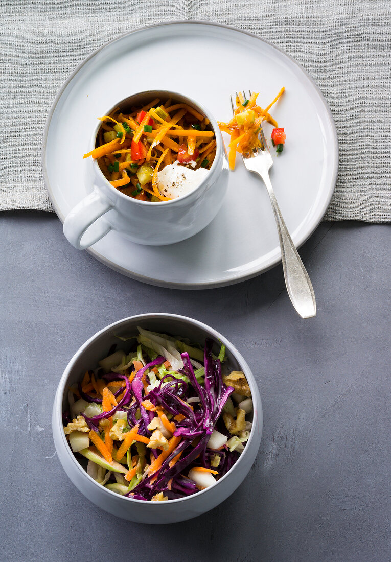 Pumpkin salad and pear salad with red cabbage in serving bowl