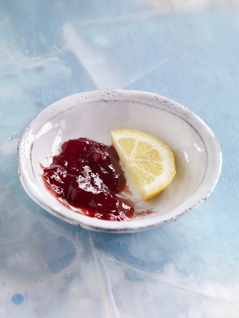 Jam, strawberry and lemon marmalade with lemon slice in bowl