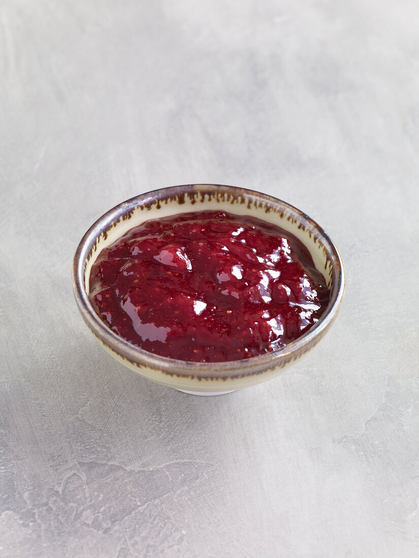 Strawberry jam with champagne in bowl