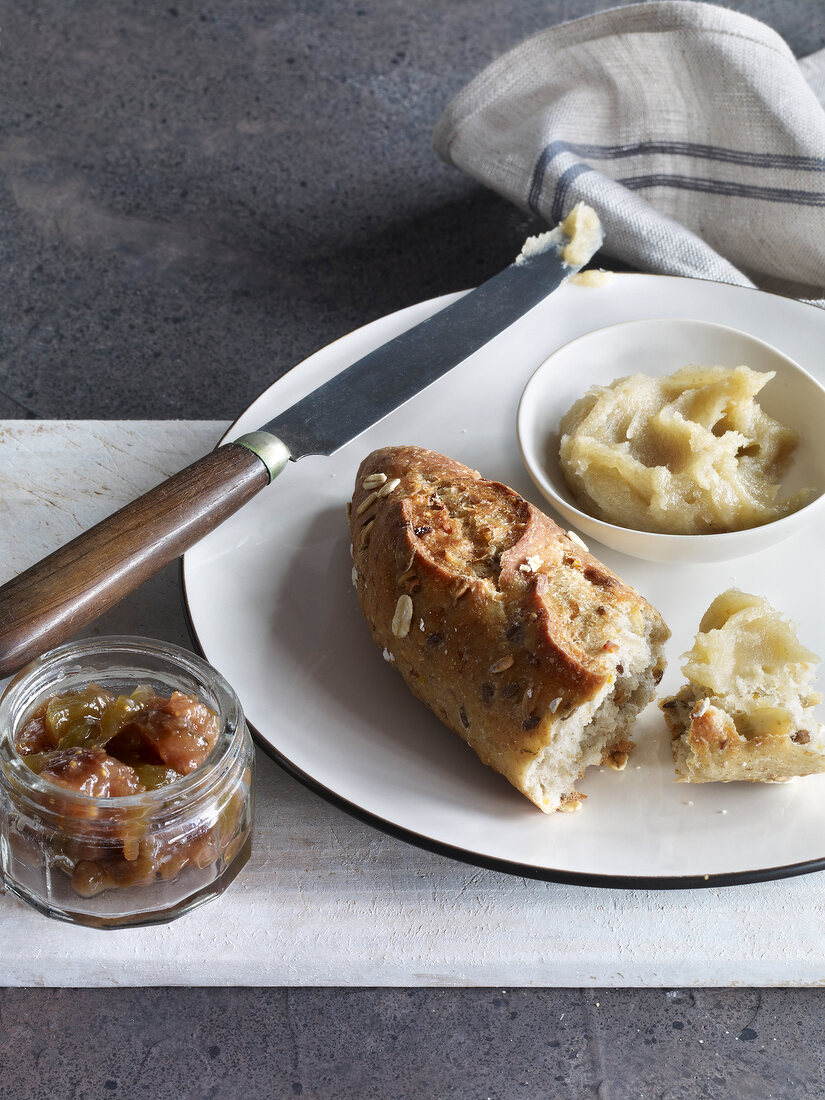 Bread loaf with marmalade jam on plate