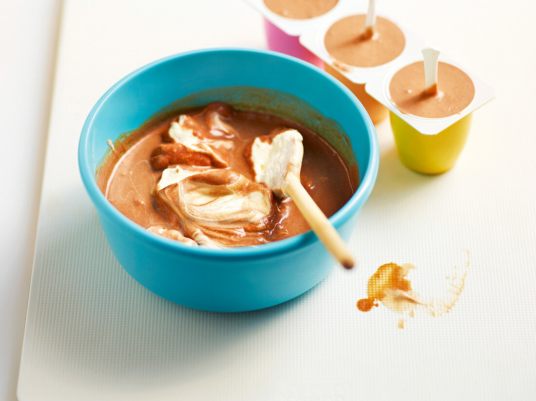 Chocolate ice cream in mould cups and bowl