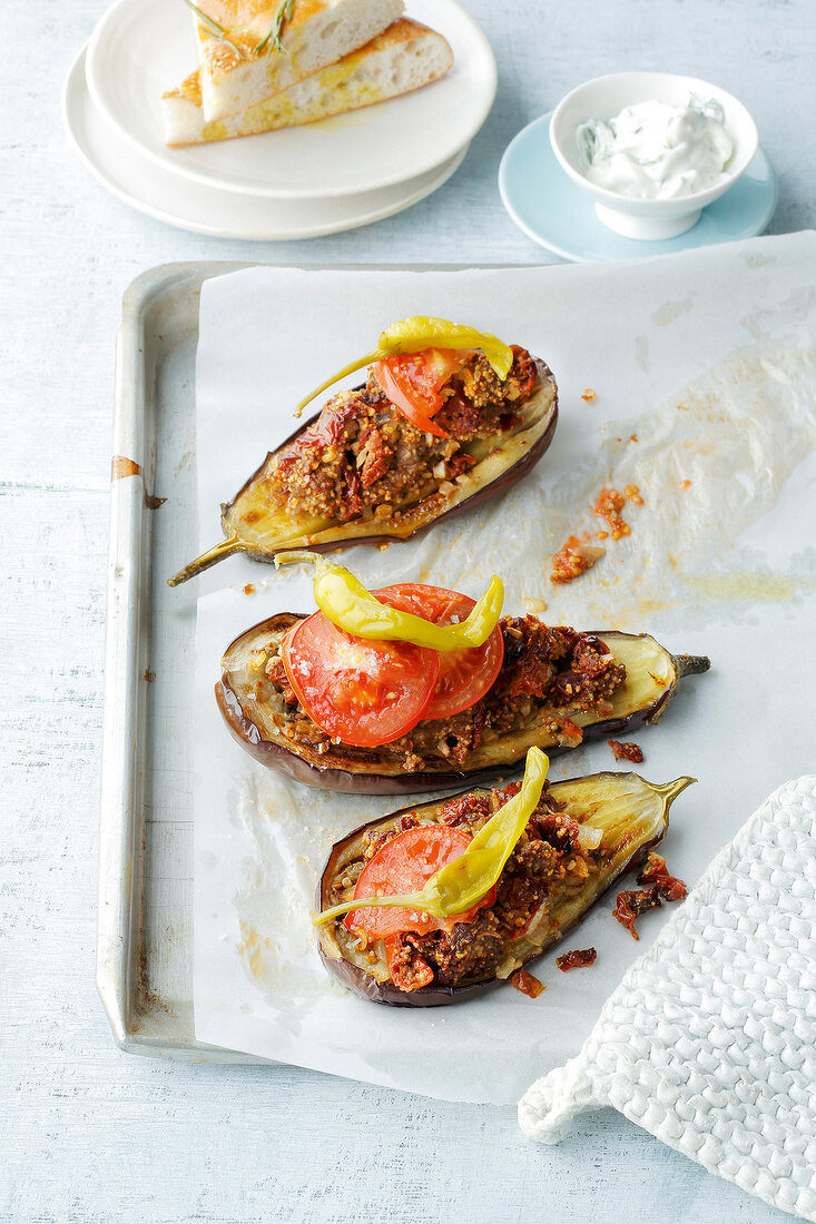 Stuffed eggplant on baking sheet