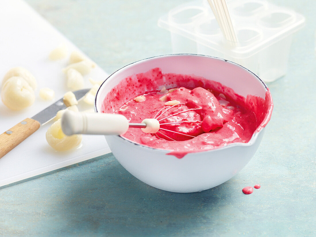 Raspberry with lychee and rose cream in bowl