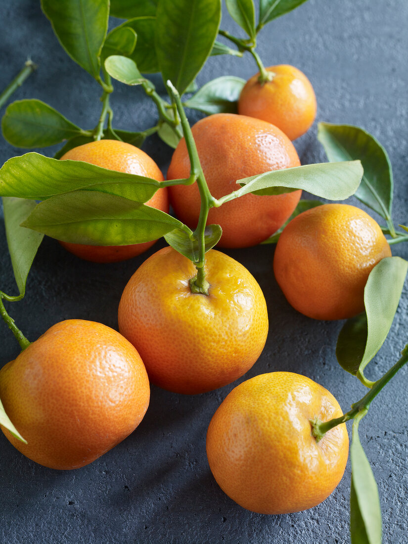 Close-up of oranges with leaves
