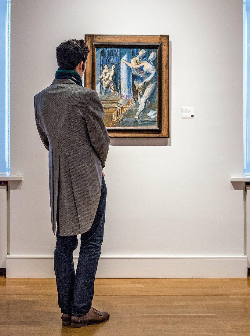 Man looking at painting in Sammlung Scharf Gerstenberg National Museum in Berlin, Germany