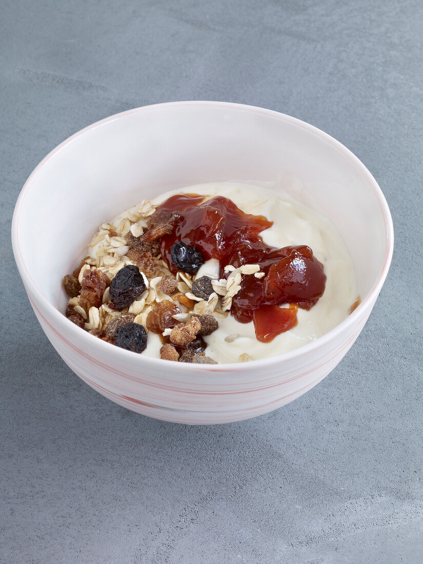 Bowl of yogurt with cereals and Hagebuttenmus