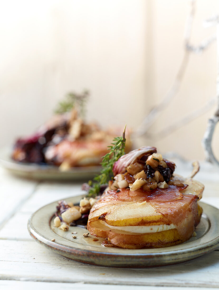 Goat's cheese and pear parcels with roasted radicchio on plate