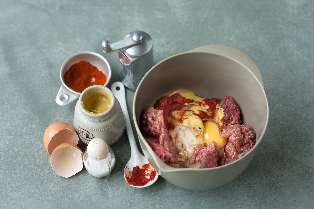 Different ingredients and minced meat in bowl, step 2