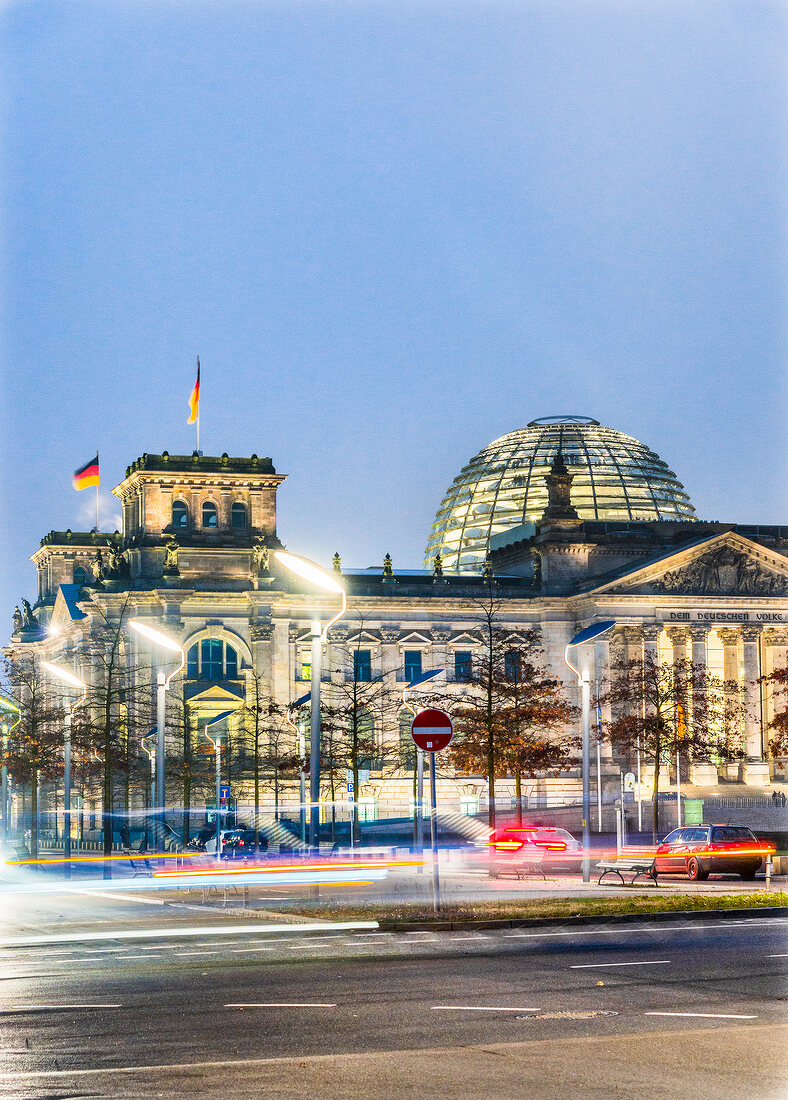 Illuminated Reichstag building at dusk, Berlin, Germany