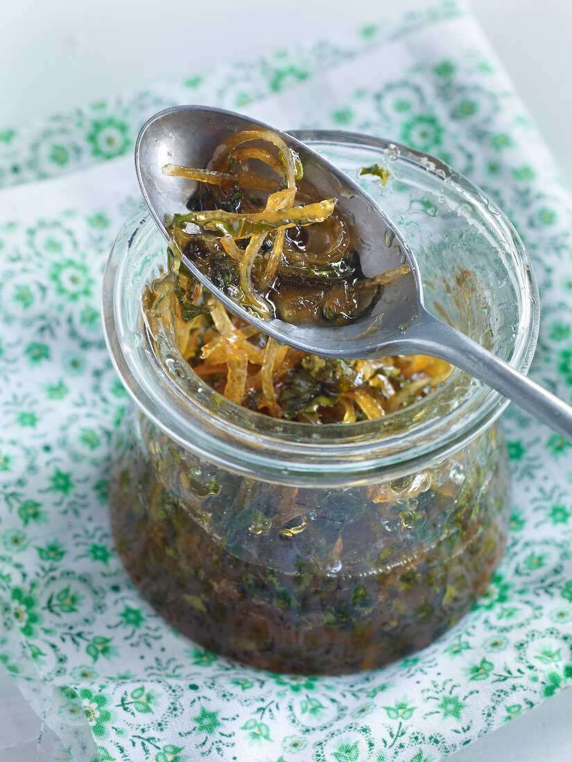 Lemon jam with basil and green pepper in jar