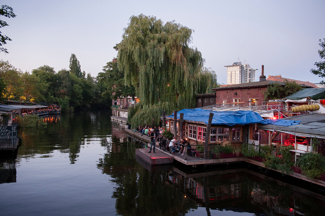 People relaxing at Club der Visionaere, Treptow, Berlin, Germany