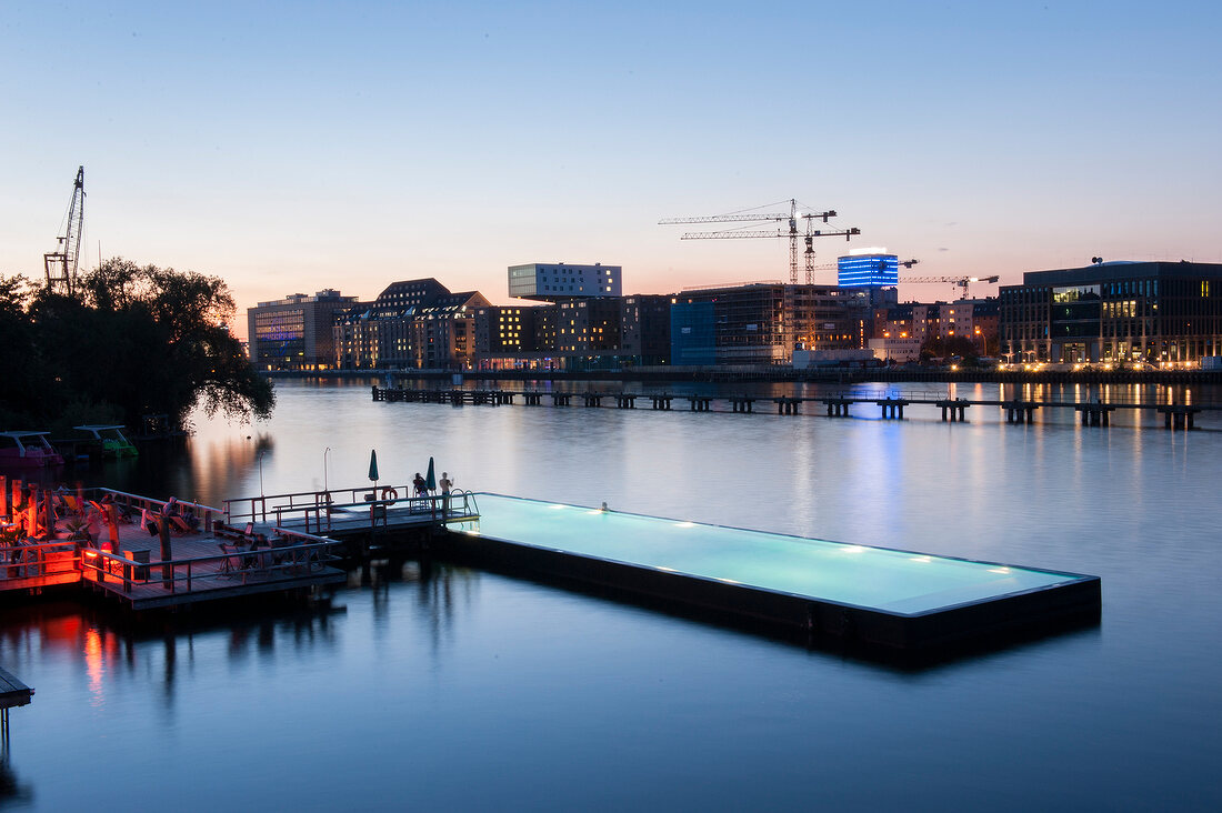 View of bathing ship pool on Spree river at dusk, Wrangelkiez, Berlin, Germany