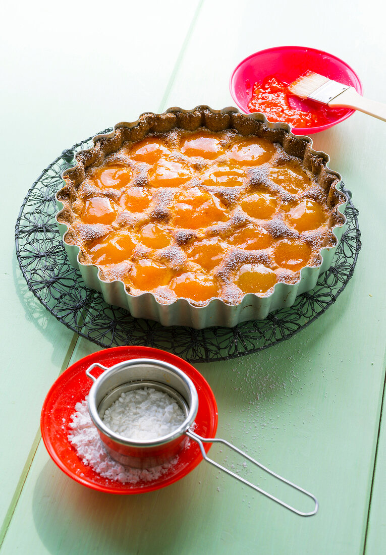 Fruit cake with apricot and almond tart in baking dish
