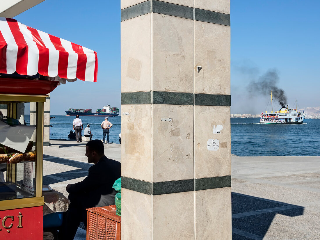View of ferry in sea and shop on promenade, Izmir, Aegean Region, Turkey