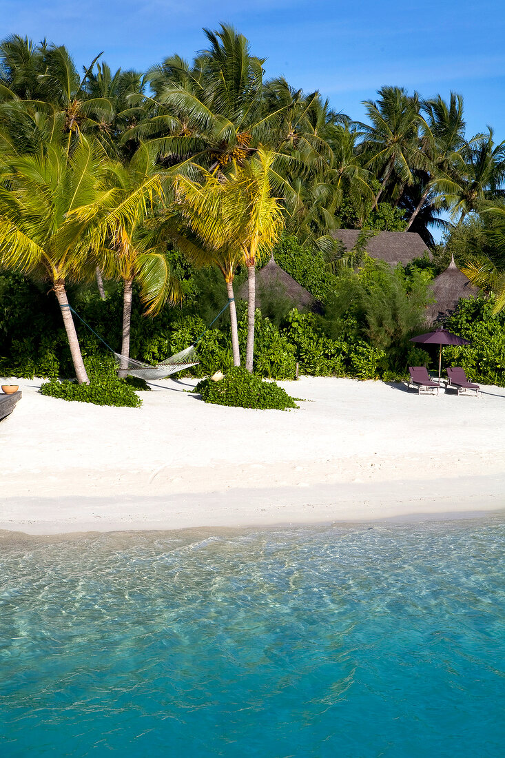 Bungalow resort on beach of island Veligandu Huraa, Maldives