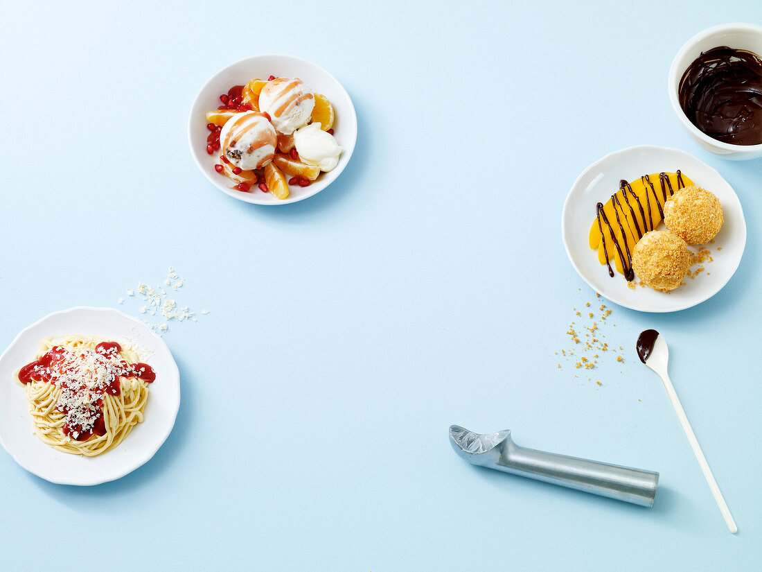 Spaghetti ice cream, walnut salad with mandarin on plate 