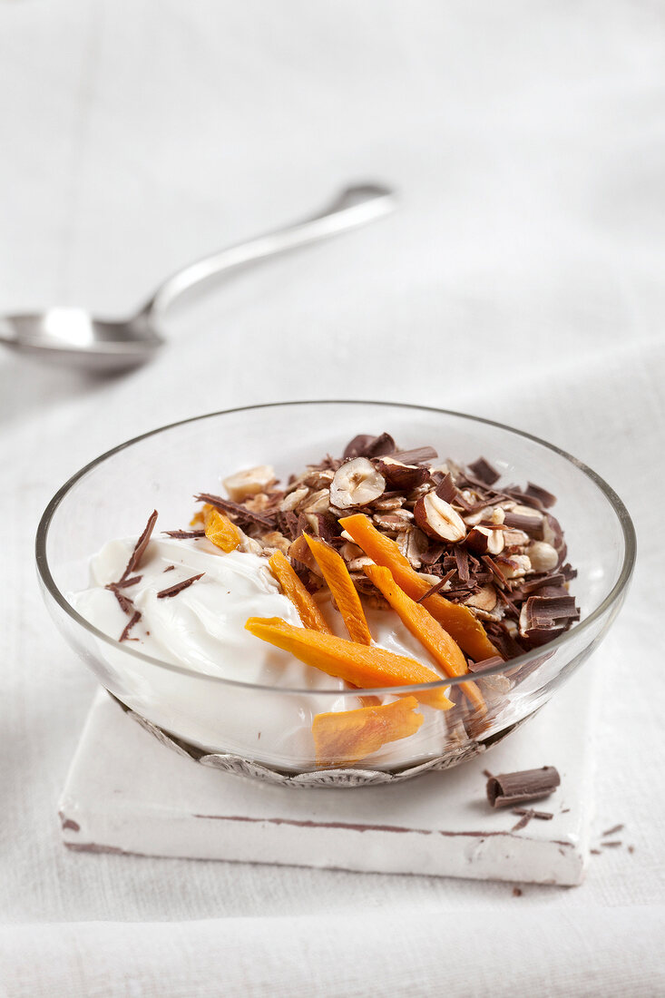 Close-up of exotic chocolate muesli in glass bowl