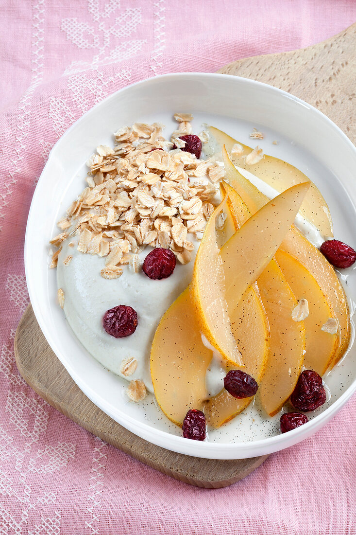 Close-up of vanilla pears with oat cream on plate