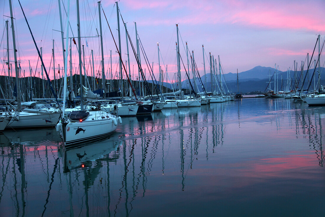 View of boats at harbour of Fethiye at night in Aegean, Turkey