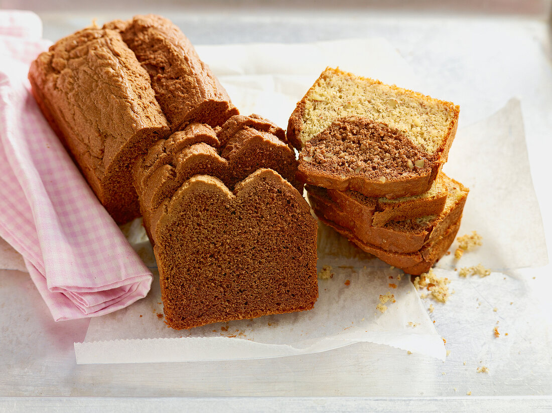 Slices of chocolate cake and chocolate banana cake with almonds