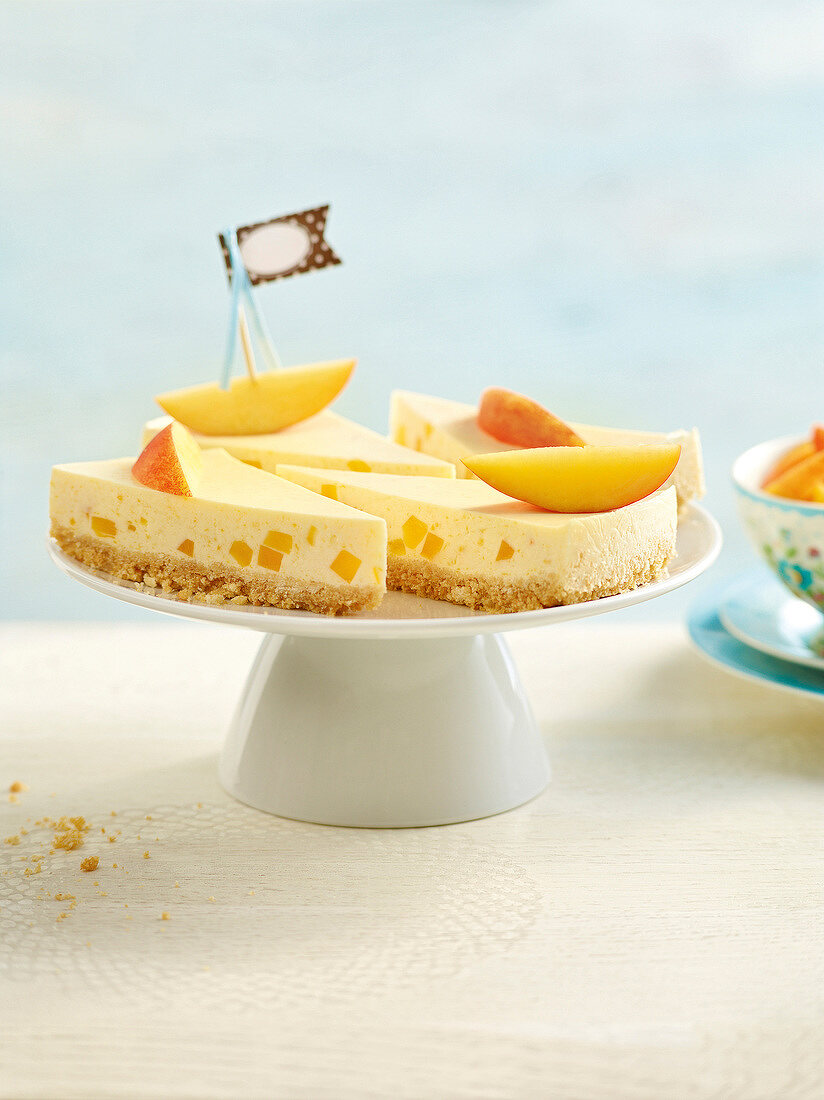 Close-up of crunchy peach pie on cake stand