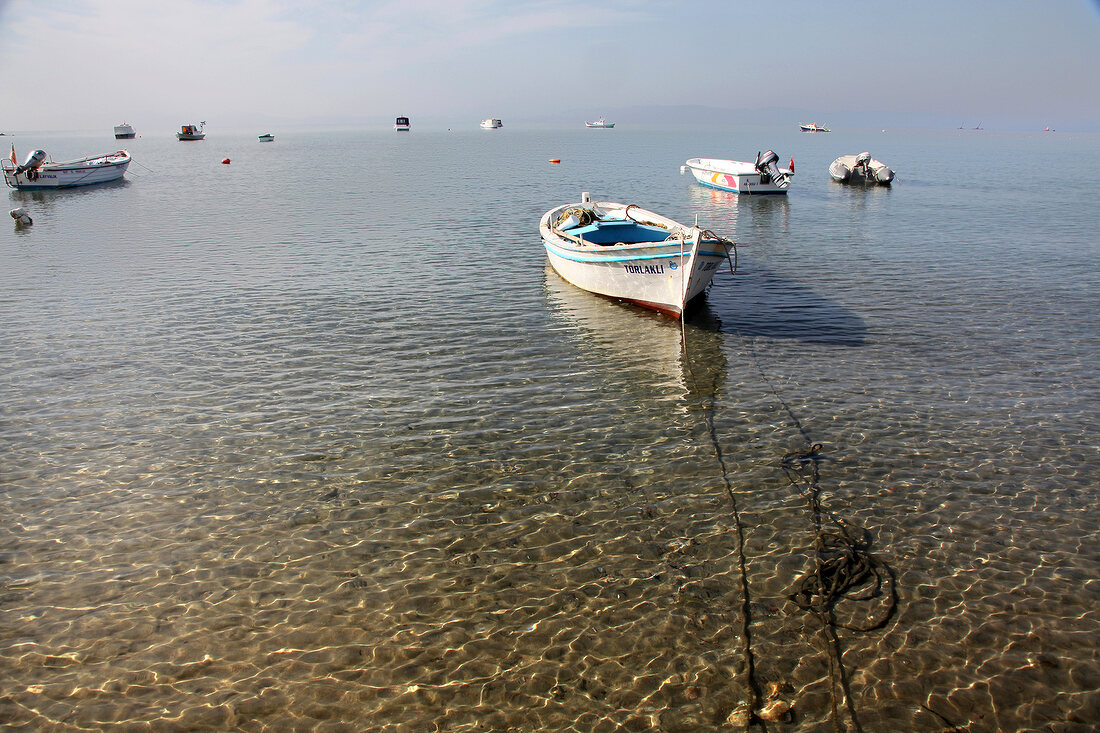 View of boats in sea at Badavut beach in Ayvalik, Aegean, Turkey