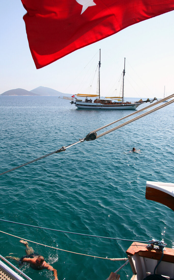 People swimming in Mediterranean peninsula, Aegean, Turkey